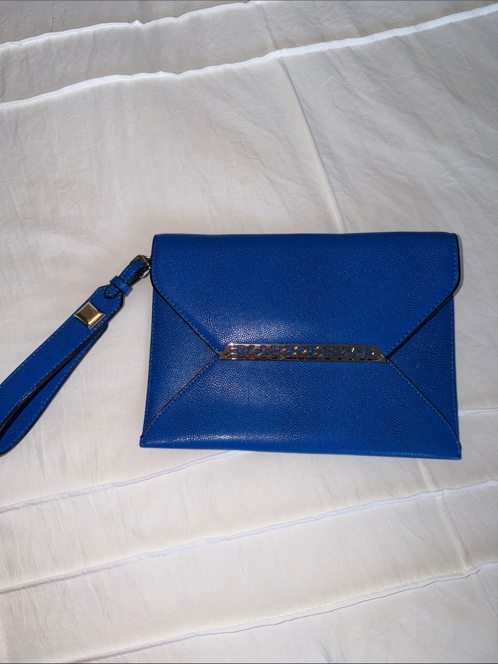 Stella & Dot Avalon Envelope Clutch featuring a distinct gold-tone geometric cl